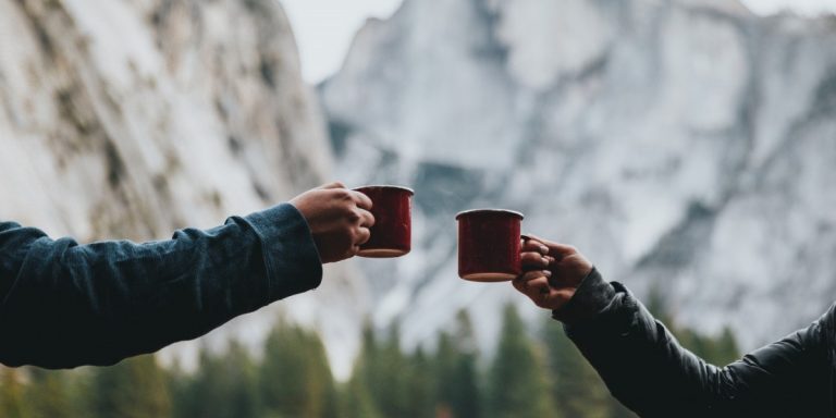 Two people having coffee in the mountains