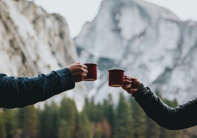 Two people having coffee in the mountains