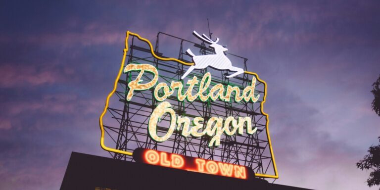 A neon sign that says Portland, Oregon